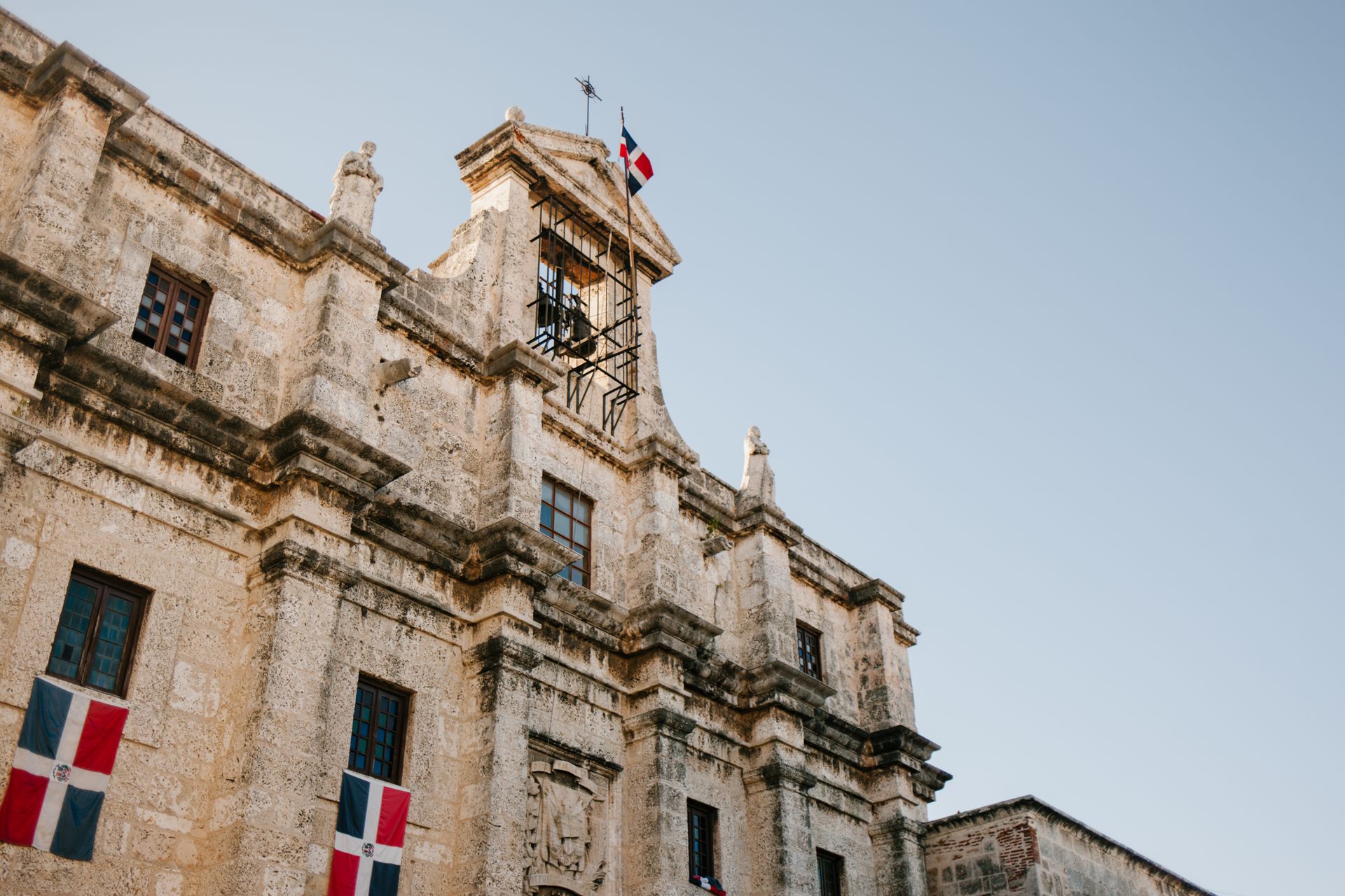 A historic facade flying the Dominican flag, Santo Domingo