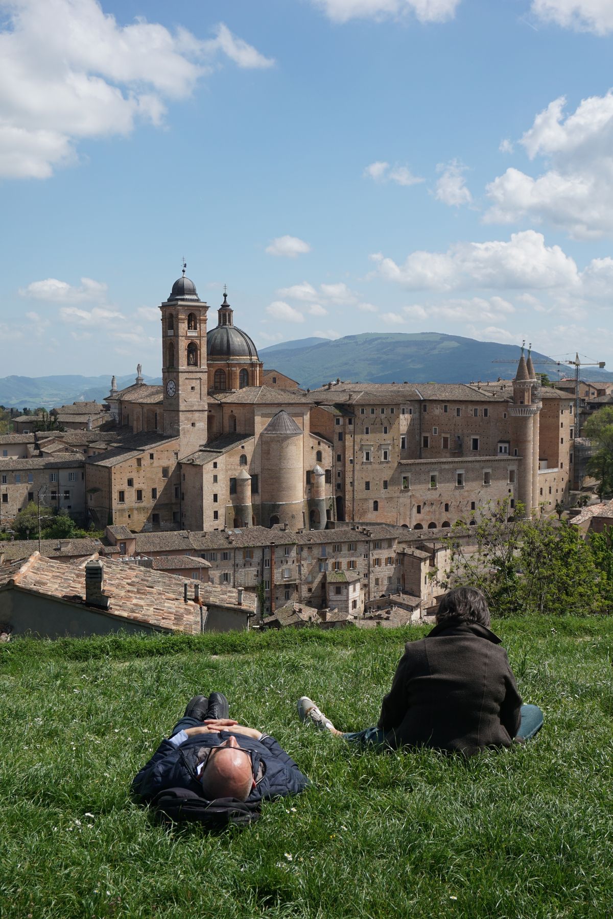 Historic hill town skyline in Le Marche under a blue sky