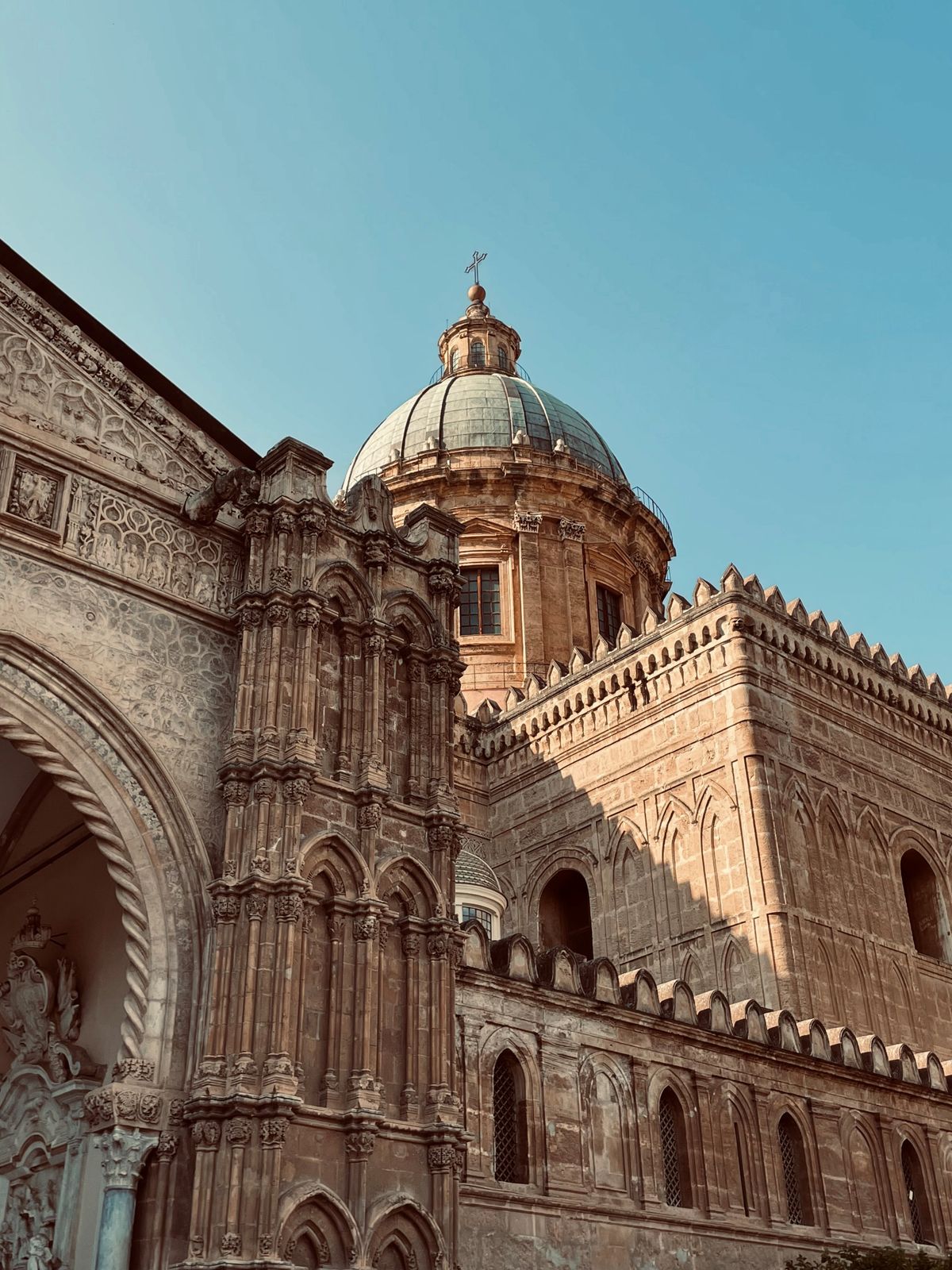 Palermo Cathedral dome and Gothic stonework under a clear sky