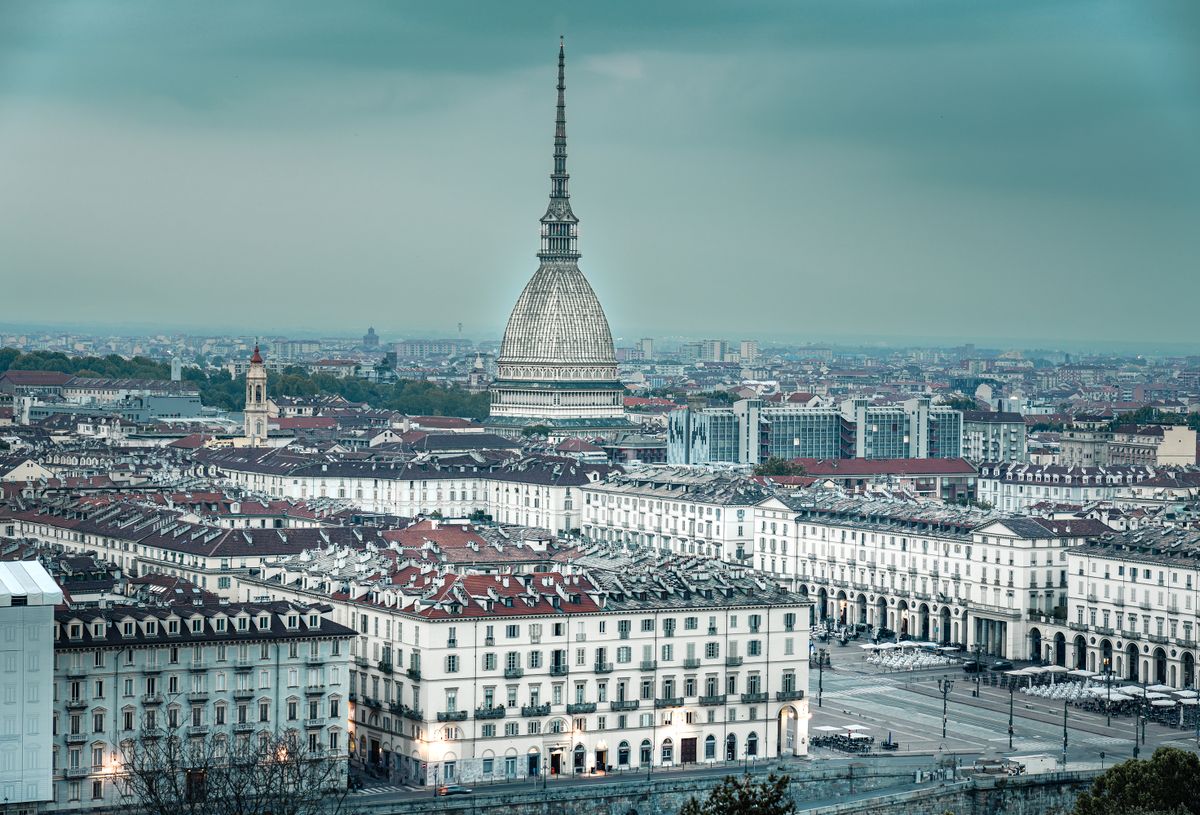 Turin skyline with the Mole Antonelliana above white palazzi