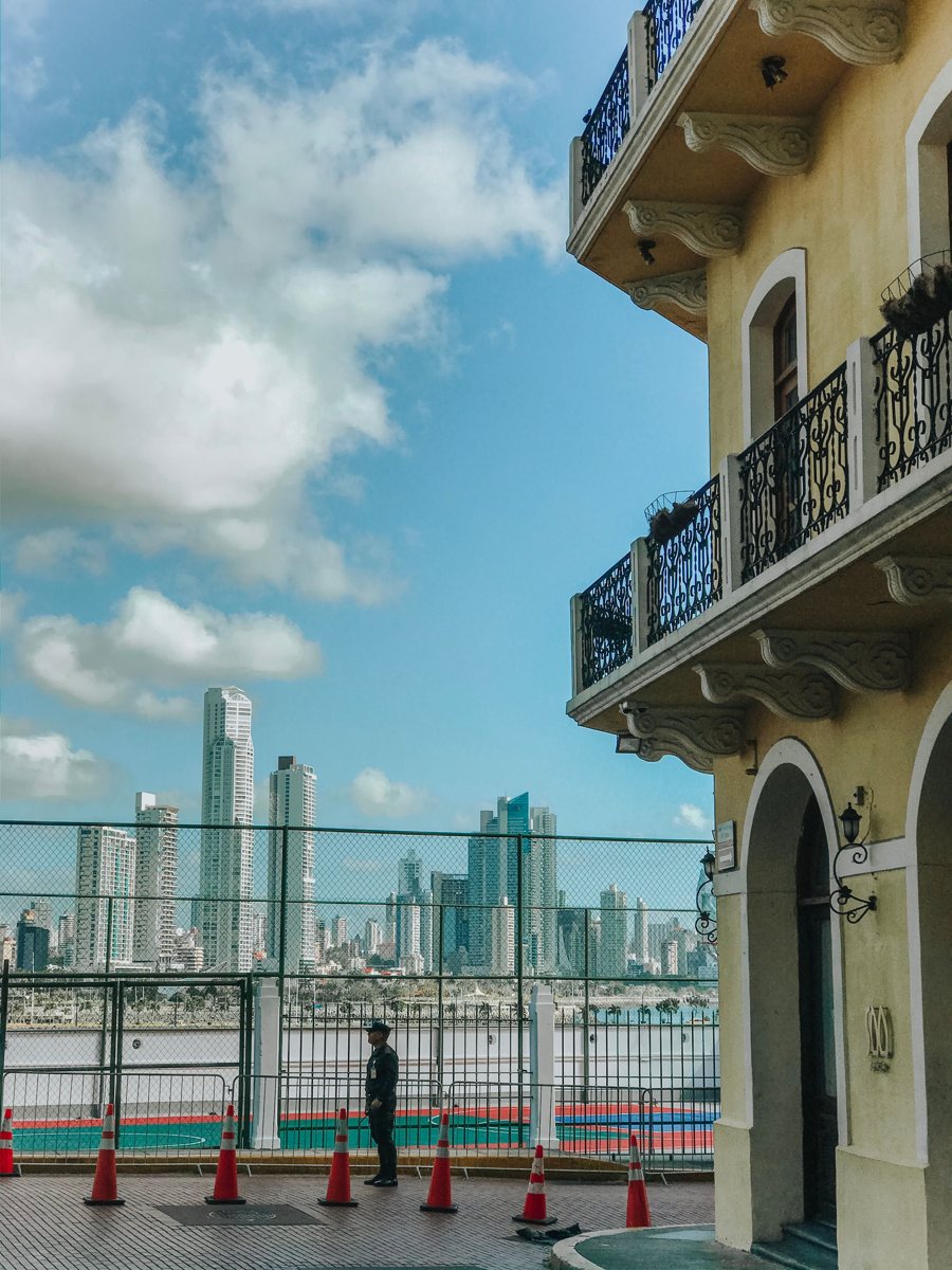 Colonial facade with Panama City's modern skyline behind it