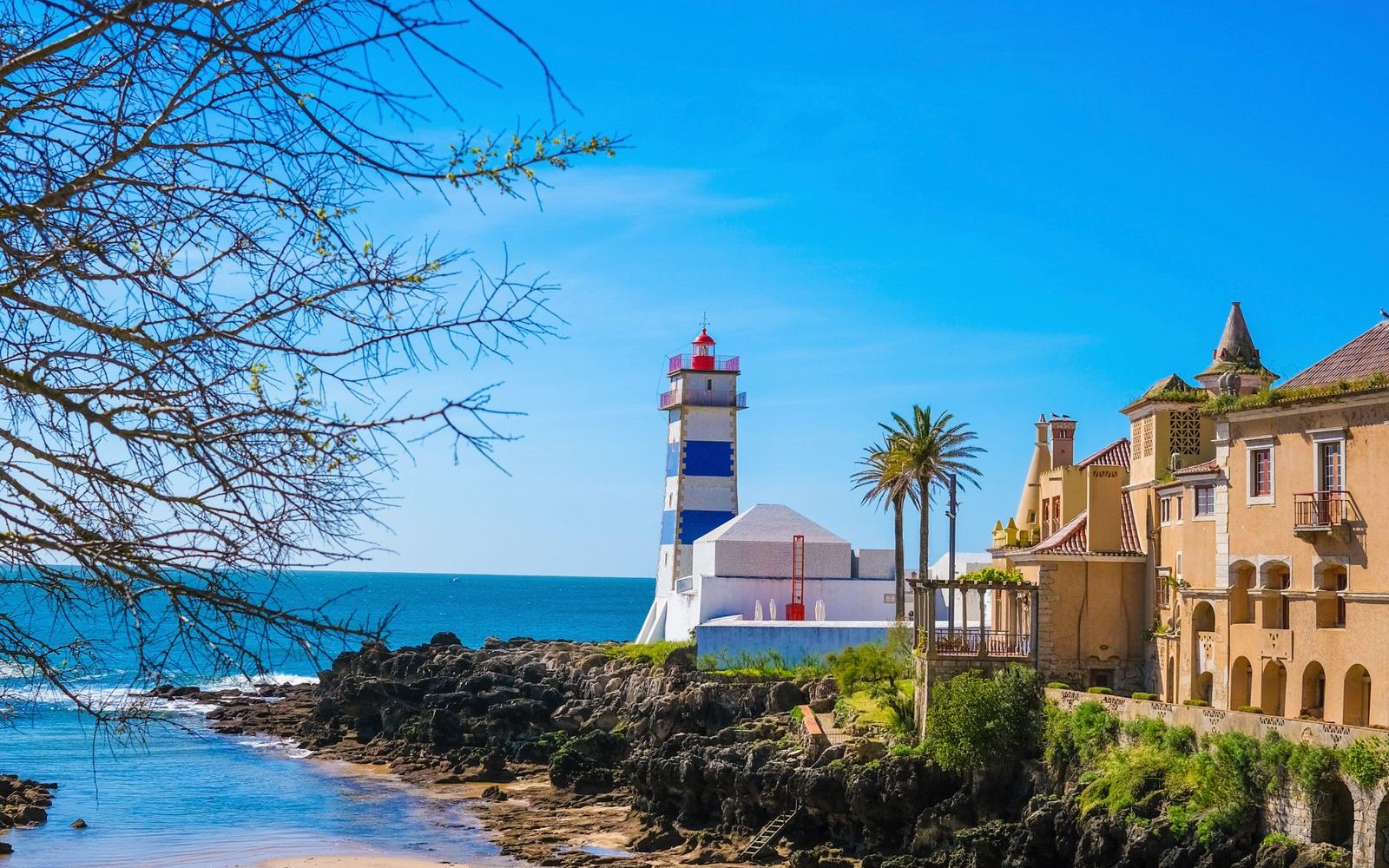 Santa Marta Lighthouse and the old-town shore in Cascais