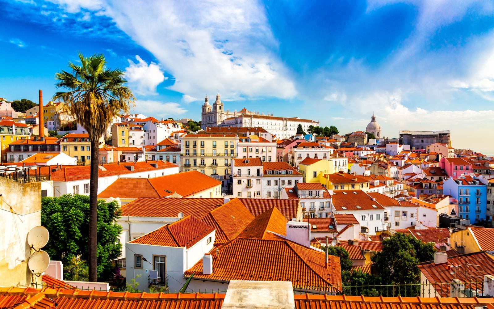 Alfama's rooftops and church towers above Lisbon's old town